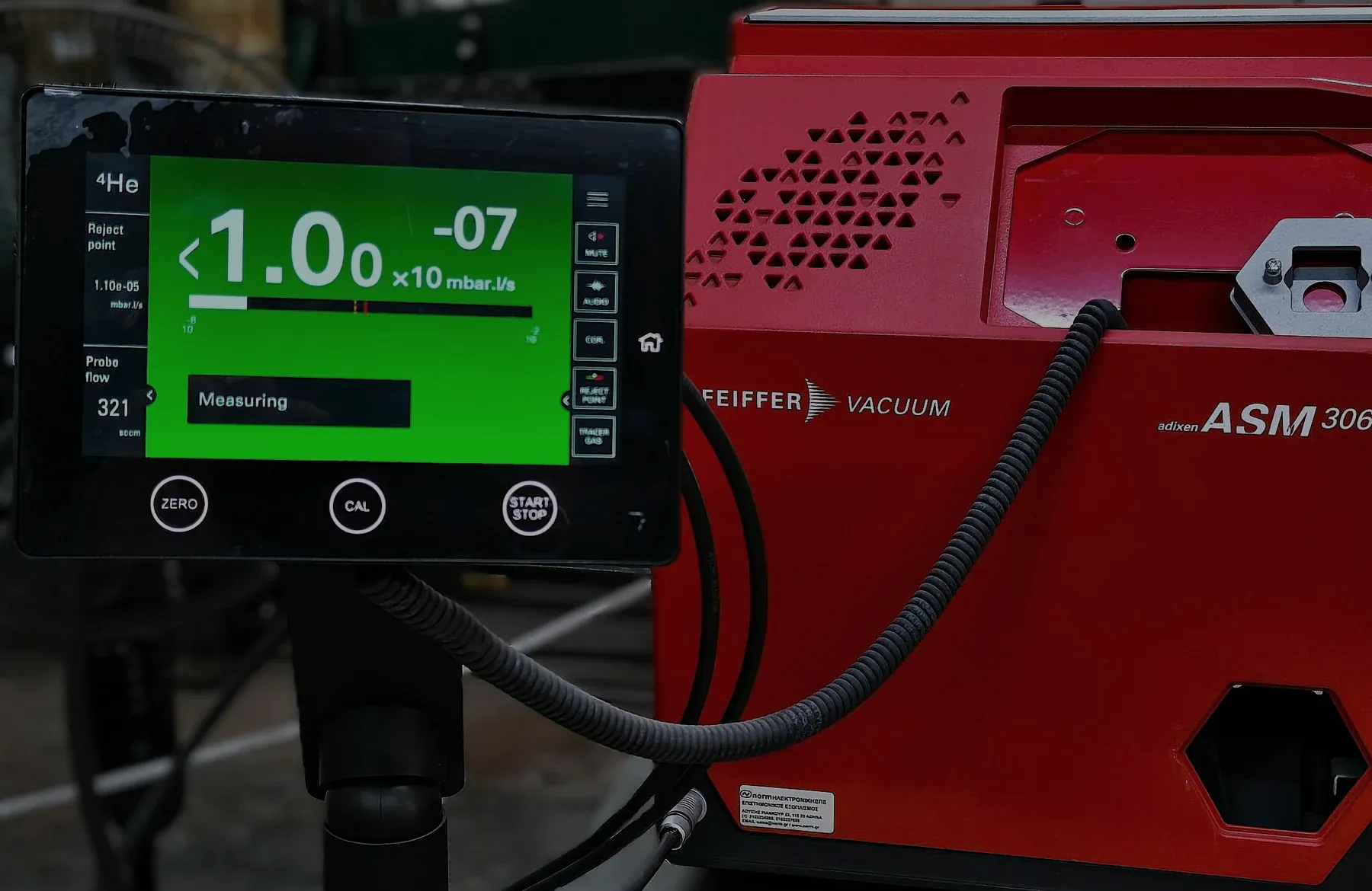 Helium leak detector testing a coil